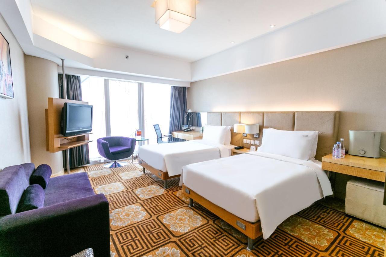 Holiday Inn Binhai Тяньцзинь Экстерьер фото